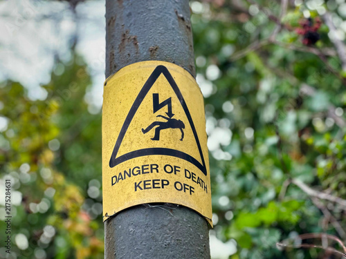 Принти на полотні Yellow Danger of Death Keep Off High Voltage Warning Sign on Utility Pole