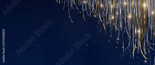 Festive gold and silver tinsel curtain background. Holiday party decoration with sparkling glitter and copy space