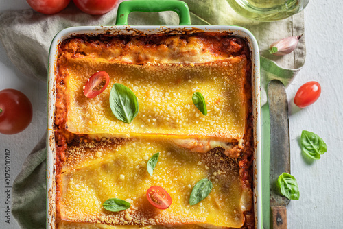 Obraz na plátně Tasty baked lasagna topped with golden melted cheese.