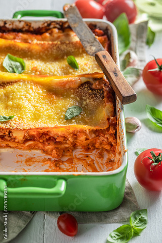 Фотография Tasty lasagna baked in a cheesy casserole.