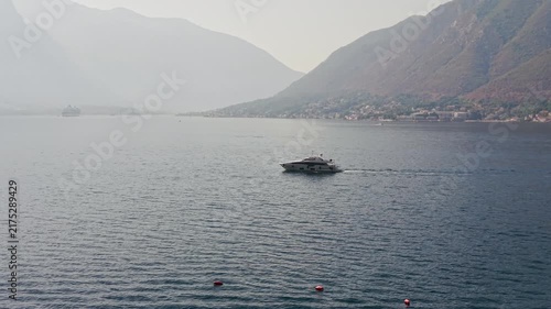 Kotor Bay Montenegro in Morning Fog with Yacht and Mountains