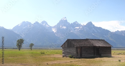 Historic wooden homesteads in a rural mountain landscape