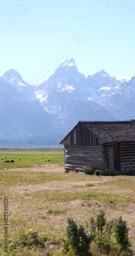 Historic wooden homesteads in a rural mountain landscape