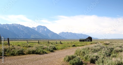 Historic wooden homesteads in a rural mountain landscape