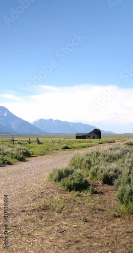 Historic wooden homesteads in a rural mountain landscape
