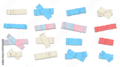 Set of various colorful adhesive tape strips and cross shapes with torn edges isolated on a black background, for scrapbooking and projects