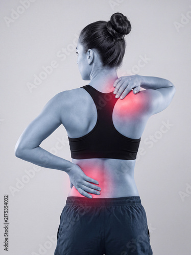 Rear View of Athletic Woman Experiencing Shoulder and Low Back Pain