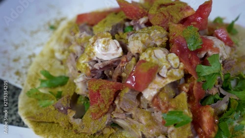 Spiced traditional Turkish sogus ingredients open on flatbread
