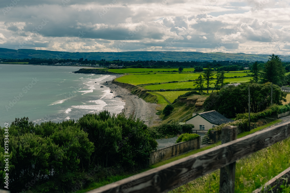 Obraz premium Coastal bay landscape in County Waterford, Ireland, near Dungarvan and the scenic Waterford Greenway cycling route - County Waterford, Ireland - 31 August 2026.
