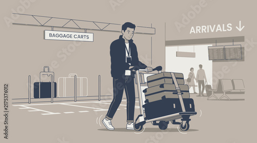 Man with luggage cart at airport arrivals