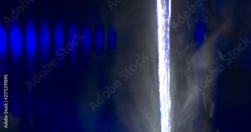 Blue and red emergency lights, abstract macro with water droplets