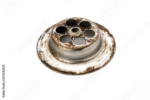 фотографія A close-up view of a round metal sink drain with a circular design