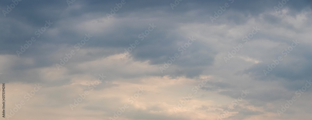 Fototapeta premium Overcast sky with dense gray clouds panoramic view at dawn