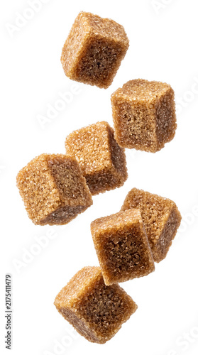 Brown sugar cubes falling isolated on transparent background