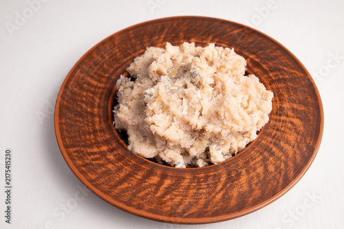 Cuadro en lienzo Raw minced fish on ceramic plate close up