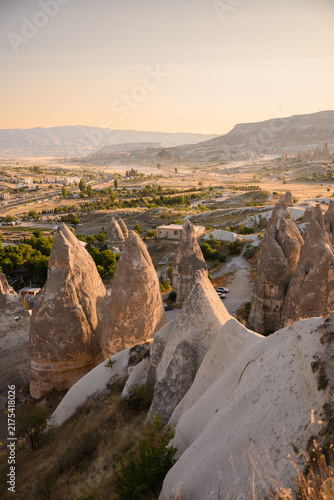 Fairy chimneys rock cones at sunset in Cappadocia Turkey for ancient heritage exploration, geological tourism and famous international landmark travel, adventure tour