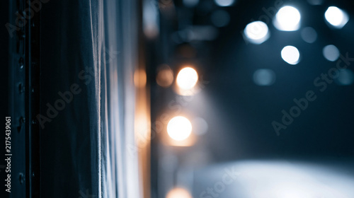 Dramatic stage lighting with soft bokeh background creating a theatrical atmosphere.