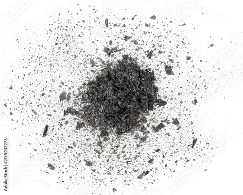 Pile of burned and charred paper scraps isolated on a white background, top view. Cinder.