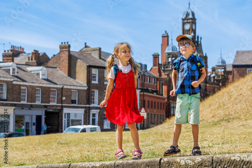 Fotografie Children walking near Clifford Tower in York, United Kingdom