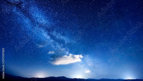 A Dark Blue Night Sky With Many Bright Stars And A Faint Cloud