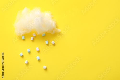 Konstfotografi Composition with cotton candy cloud and marshmallows on yellow background