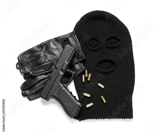 Cuadro en lienzo Balaclava with gloves, gun and bullets on white background