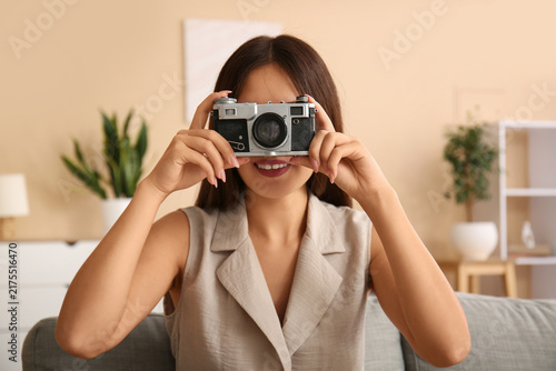 Young Asian woman taking selfie at home, closeup