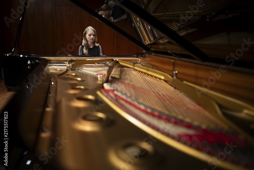 Young woman, pianist playing on an unfolded Steinway & Sons grand piano, Stuttgart, Baden-Württemberg, Germany