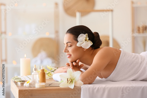 Young woman relaxing in spa salon, closeup