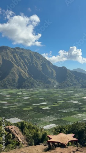 Dramatic Green Mountain Ridge Under a Blue Sky

