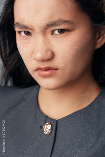 фотографія Woman with frown and serious face closeup portrait showing negative emotion, displeasure or anger