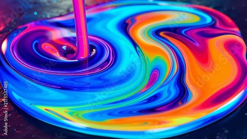 Vibrant abstract liquid art with swirling neon colors and fluid motion