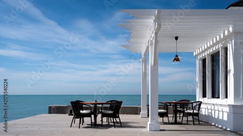 Serene Coastal Dining Space with White Architecture and Ocean View