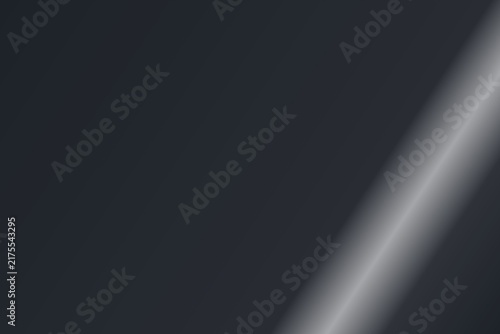 Smooth dark grey background featuring a bright diagonal light reflection.