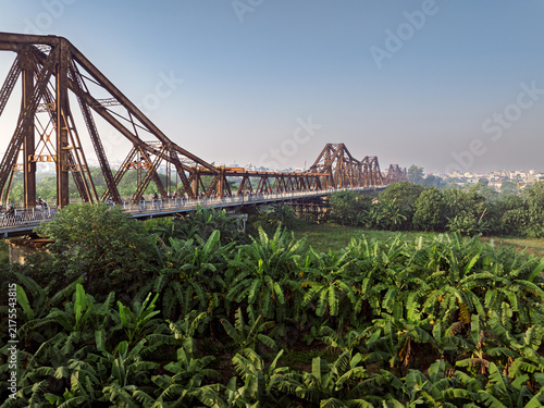 Long Bien Bridge over a banana plantation in Hanoi, Vietnam