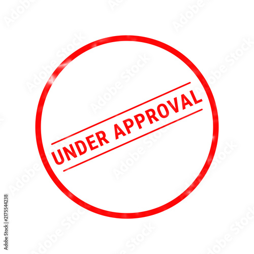 Obraz na płótnie A bright red circular rubber stamp clearly shows the words under approval in a s