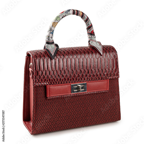 Elegant Red Luxury Handbag with Snakeskin Texture and Silk Scarf Wrap. premium red fashion handbag  isolated on white background.