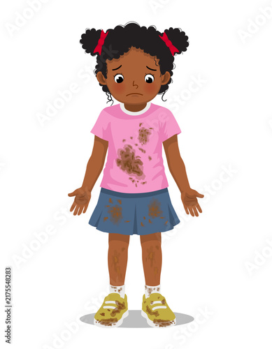 Little African girl in dirty muddy stained clothes look upset
