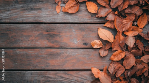 Rustic wooden planks adorned with autumn leaves