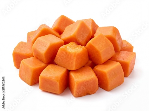 Fresh orange papaya cubes stacked on a white background