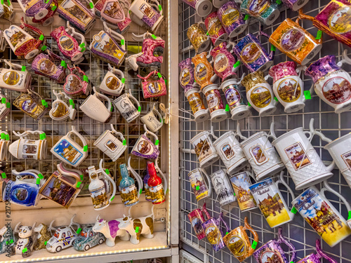 Fotografie Rows of mugs with different designs are shown for sale in a shop in Karlovy Vary, Czechia