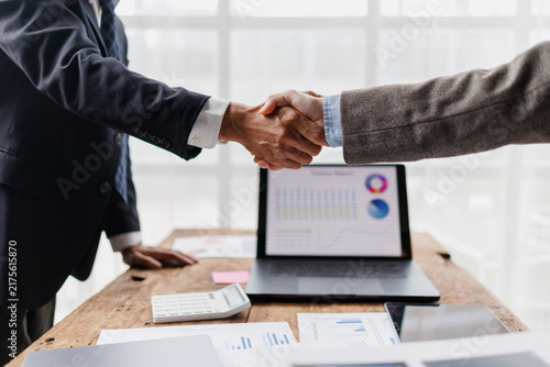 Konstfotografi Business professionals shaking hands, establishing a partnership and agreement,