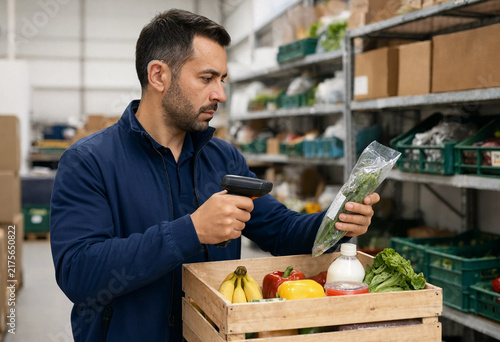 Man scans produce in a warehouse