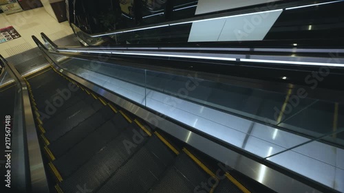 Pov heading down an empty escalator