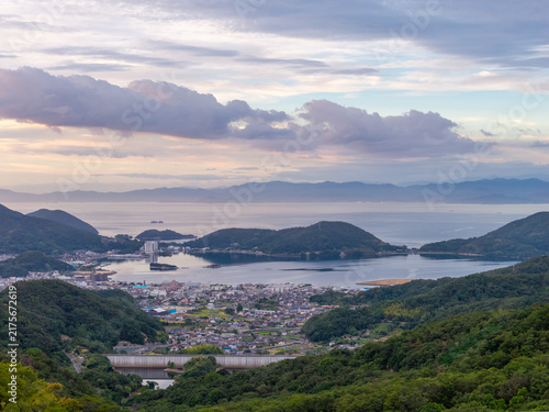 Coastal town in protected bay with sunrise color in sky on Shodoshima Island, Japan