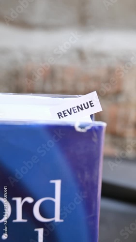 Revenue Word on White Paper Representing Earnings Profit and Financial Success