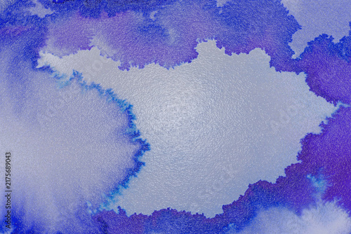 Abstract blue and purple ink bleed with irregular edges on a textured light gray surface