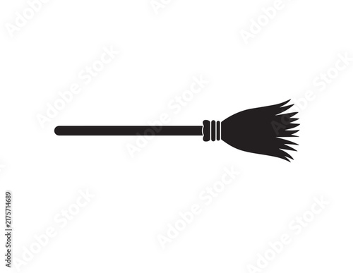 Fotografie Simple black silhouette icon of a witch broomstick for Halloween party design an