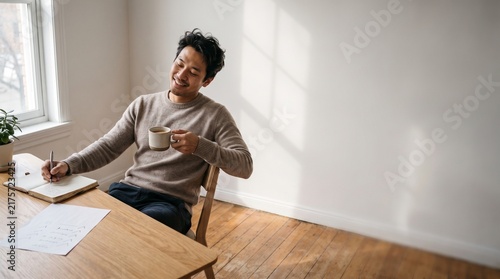 Young Man Celebrating a Small Personal Achievement at Home