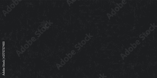 A top-quality vintage-style black grunge texture featuring white scratches and an old film grain effect. White scratches and dust set against a black background with empty space.